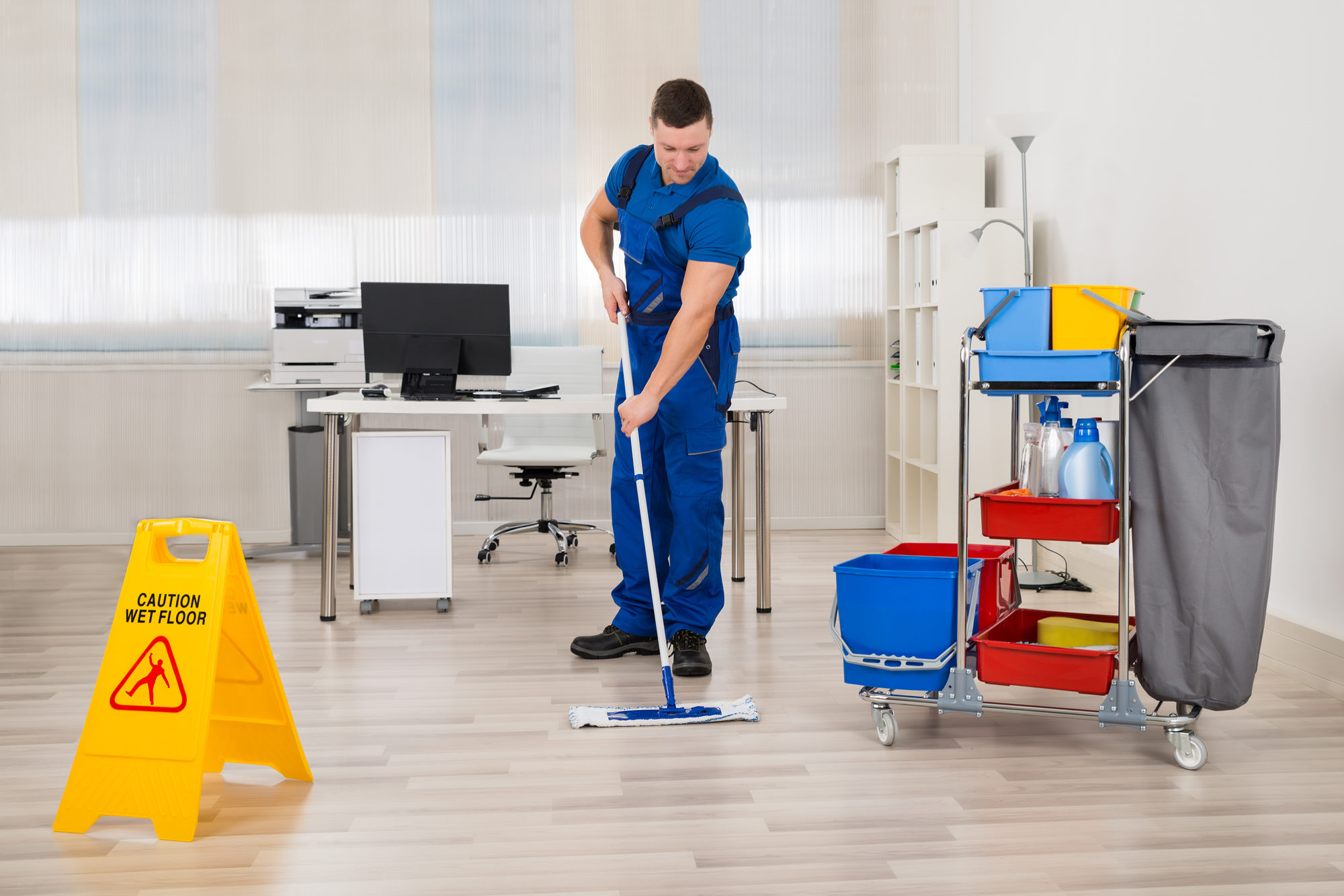person mopping the floor